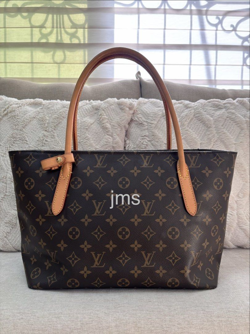 Louis Vuitton Monogram Raspail PM (Category: Luxury Bags & Wallets) located in Manaoag. Submitted by jomacario (Listing ID 1469624704, Image 1). Description: - Very Good Condition - Classic Monogram Canvas Design - Secure zip-top closure - Dual tan leather shoulder straps with yellow contrast stitching, very minor discoloration on one handle - Elegant gold-tone hardware - Clean and spacious dark purple interior lining.