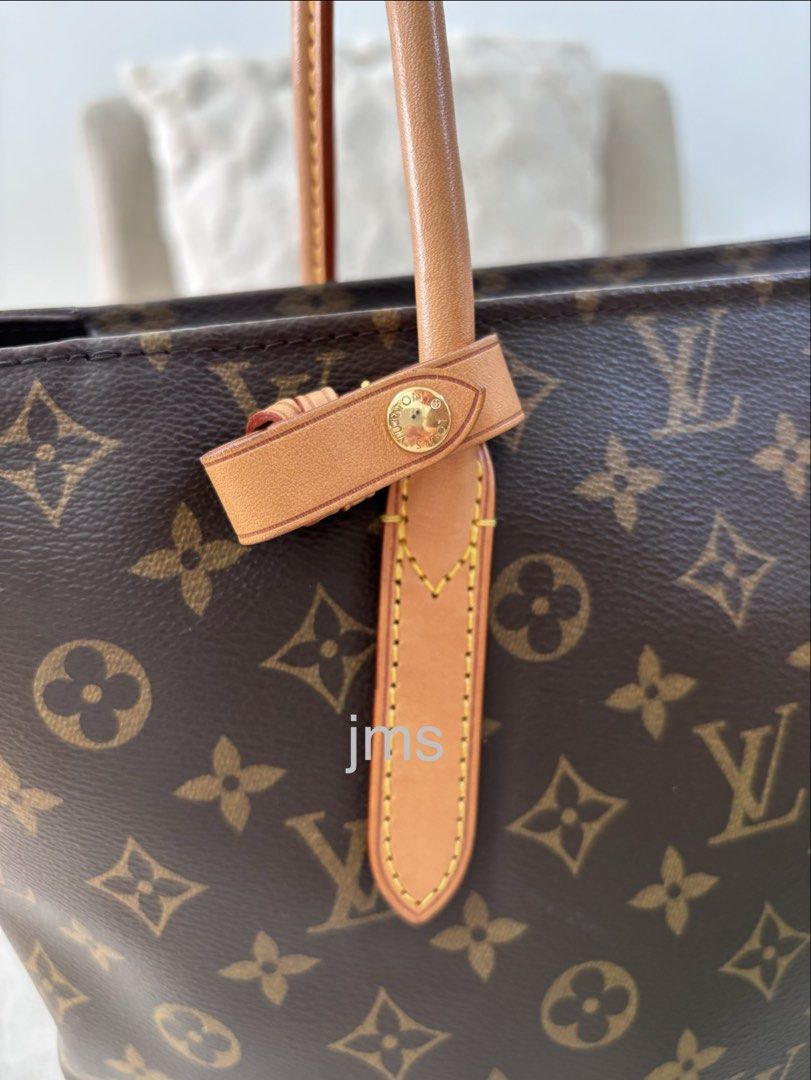 Louis Vuitton Monogram Raspail PM (Category: Luxury Bags & Wallets) located in Manaoag. Submitted by jomacario (Listing ID 1469624704, Image 3). Description: - Very Good Condition - Classic Monogram Canvas Design - Secure zip-top closure - Dual tan leather shoulder straps with yellow contrast stitching, very minor discoloration on one handle - Elegant gold-tone hardware - Clean and spacious dark purple interior lining.
