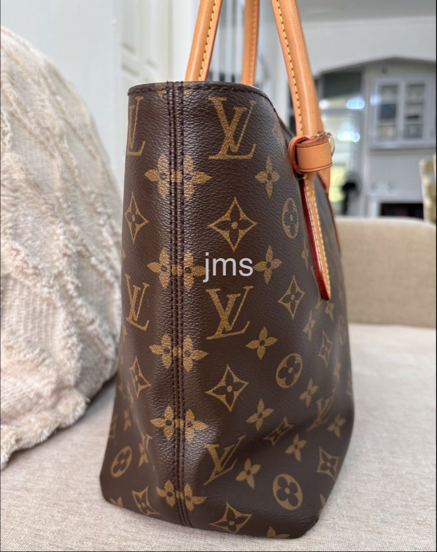 Louis Vuitton Monogram Raspail PM (Category: Luxury Bags & Wallets) located in Manaoag. Submitted by jomacario (Listing ID 1469624704, Image 2). Description: - Very Good Condition - Classic Monogram Canvas Design - Secure zip-top closure - Dual tan leather shoulder straps with yellow contrast stitching, very minor discoloration on one handle - Elegant gold-tone hardware - Clean and spacious dark purple interior lining.