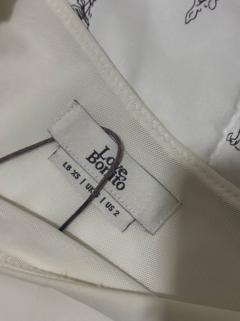 Love Bonito White Off Shoulder Bodysuit (Category: Sleeveless) located in Cainta. Submitted by thriftedbymimi_ (Listing ID 1469675462, Image 2). Description: - Brand: Love Bonito -minimal stains, can be removed w bleach price is negotiable, bundle deals available. send a message MOP: Gcash/Maribank/Gotyme/Bank Transfer MOD: lalamove .