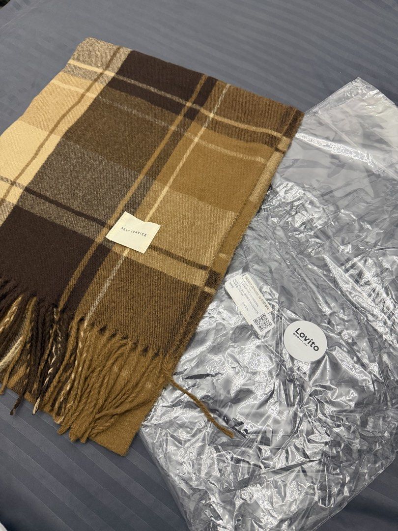 Lovito Brown Plaid Winter Scarf (Category: Scarves) located in Manila. Submitted by karminareyes123 (Listing ID 1469679702, Image 1). Description: - Brown and beige plaid scarf with stylish fringe ends - Soft and cozy medium-thickness fabric - Neutral color palette, ideal for autumn and winter layering - One size fits all - Brand new with original brand label and ziplock packaging.
