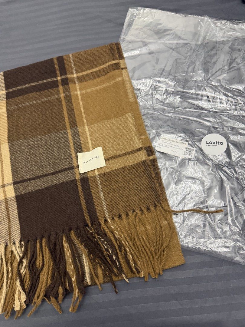 Lovito Brown Plaid Winter Scarf (Category: Scarves) located in Manila. Submitted by karminareyes123 (Listing ID 1469679702, Image 2). Description: - Brown and beige plaid scarf with stylish fringe ends - Soft and cozy medium-thickness fabric - Neutral color palette, ideal for autumn and winter layering - One size fits all - Brand new with original brand label and ziplock packaging.