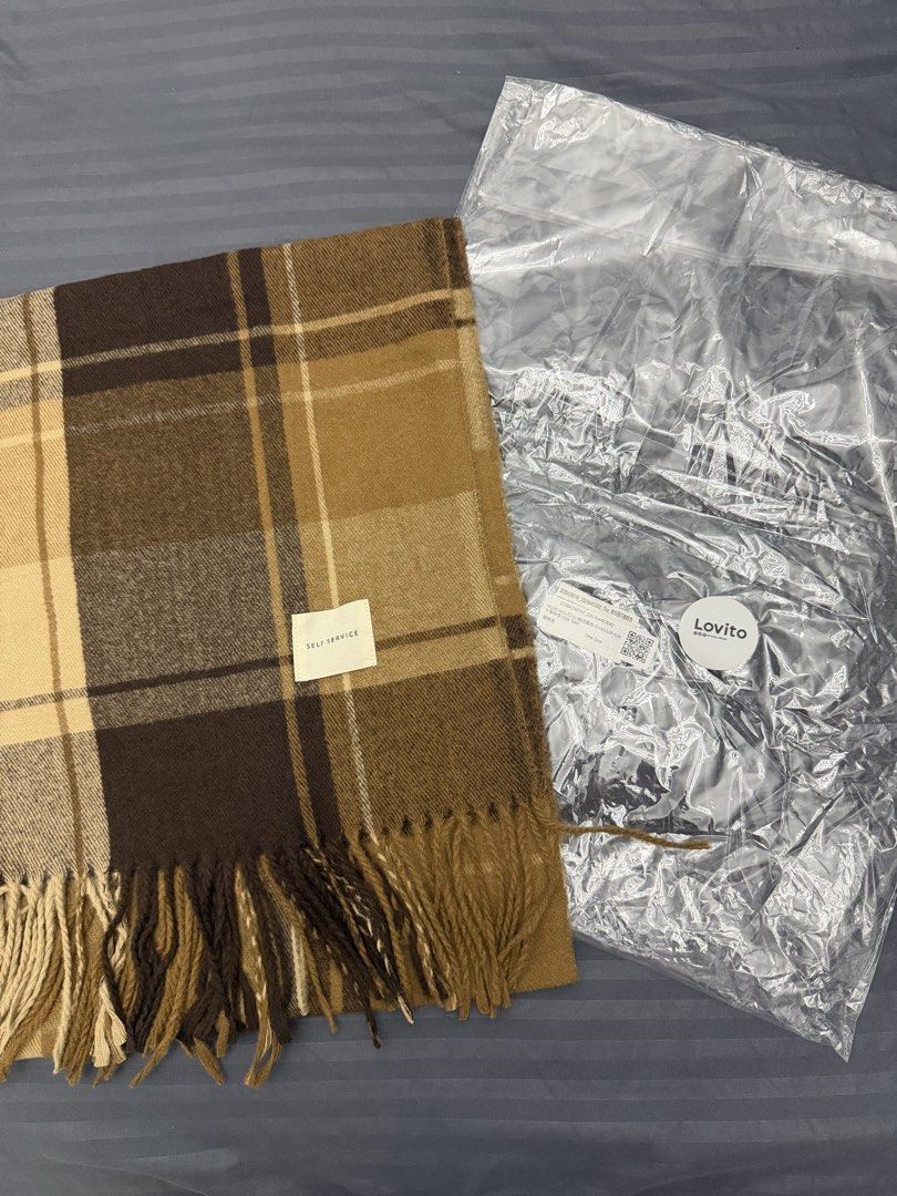 Lovito Brown Plaid Winter Scarf (Category: Scarves) located in Manila. Submitted by karminareyes123 (Listing ID 1469679702, Image 3). Description: - Brown and beige plaid scarf with stylish fringe ends - Soft and cozy medium-thickness fabric - Neutral color palette, ideal for autumn and winter layering - One size fits all - Brand new with original brand label and ziplock packaging.