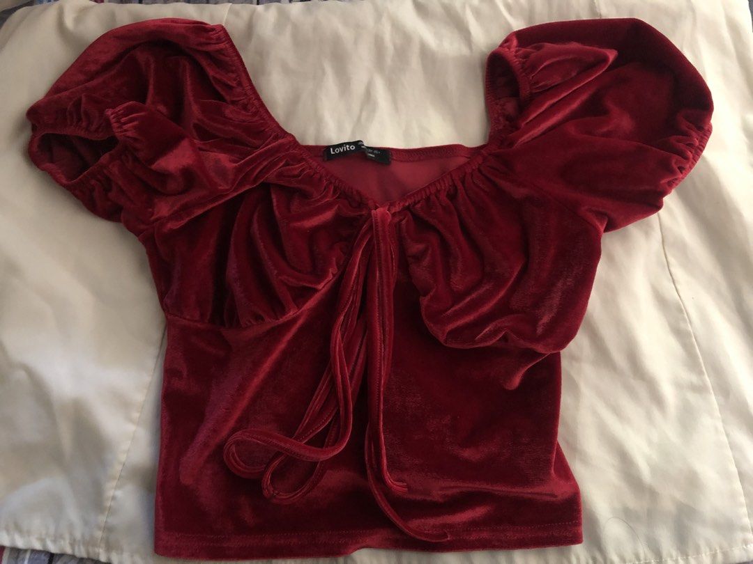 Lovito Red Velvet Puff Sleeve Top (Category: Blouses) located in Manila. Submitted by seethestarrz (Listing ID 1469716458, Image 1). Description: - Brand: Lovito - Material: Soft red velvet with a slight stretch - Design: Square neckline with short puff sleeves and elastic shoulders - Detail: Center front tie with long drawstrings perfect for snow white halloween costume 🫶 📍qc, metro manila 🚚 jnt, sf shouldered by buyer .