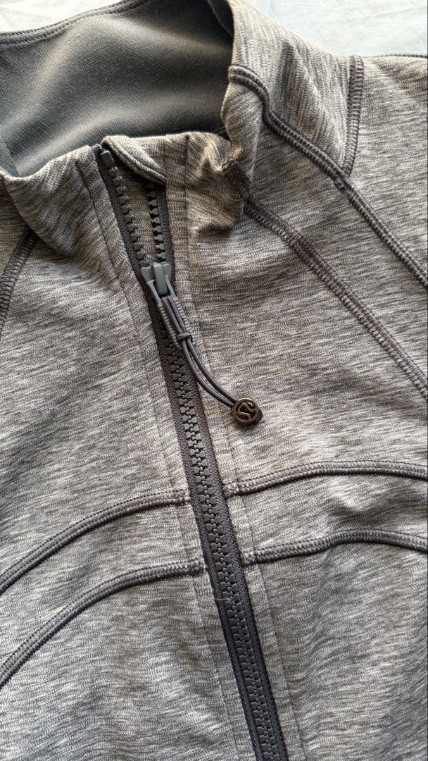 Lululemon Define Jacket Grey Heathered Size 10 (Category: Coats, Jackets and Outerwear) located in Mandaluyong City. Submitted by tidyingupnow (Listing ID 1469652385, Image 2). Description: - Brand: Lululemon - Item: Define Jacket - Color: Heathered Grey - Size: 10 - Full-zip closure with high collar style - Features thumbholes and secure zipper pockets - Signature curved seaming for a flattering, fitted athletic look - Soft and stretchy nylon, p