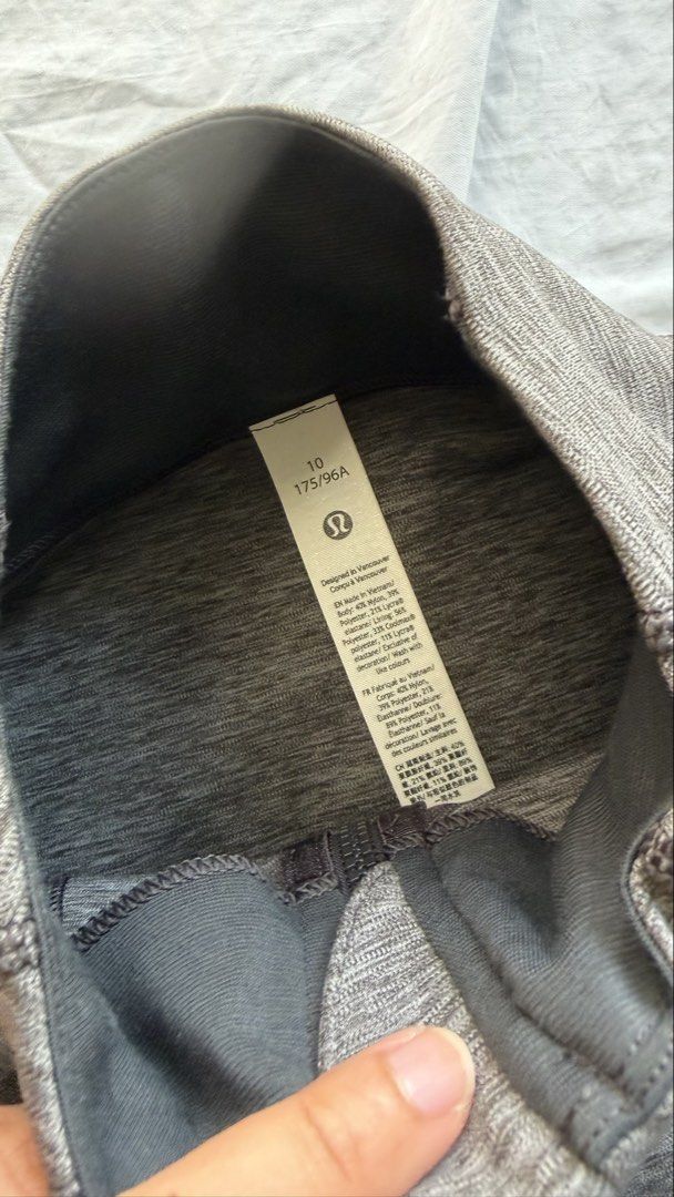 Lululemon Define Jacket Grey Heathered Size 10 (Category: Coats, Jackets and Outerwear) located in Mandaluyong City. Submitted by tidyingupnow (Listing ID 1469652385, Image 3). Description: - Brand: Lululemon - Item: Define Jacket - Color: Heathered Grey - Size: 10 - Full-zip closure with high collar style - Features thumbholes and secure zipper pockets - Signature curved seaming for a flattering, fitted athletic look - Soft and stretchy nylon, p