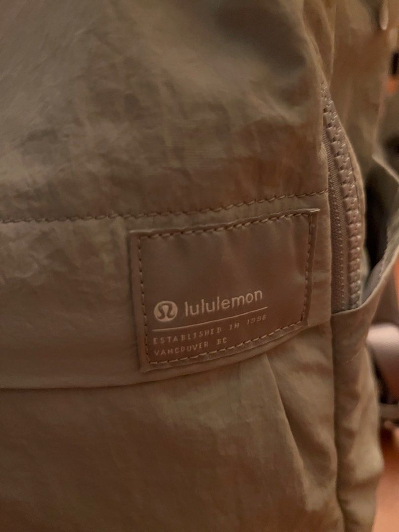 Lululemon Everyday Backpack (Category: Backpacks) located in Las Pinas. Submitted by basicapparel_mnl (Listing ID 1469698125, Image 2). Description: - Brand: Lululemon - Price Still negotiable - Original (See tag) - Color: Light Grey - Material: 100% Nylon body, 100% Polyester lining and mesh - Origin: Made in Indonesia - Closure: Secure top zip - Pockets: Front zip pocket with woven brand patch & mesh inner lining - Comfort: Padded shoulder stra
