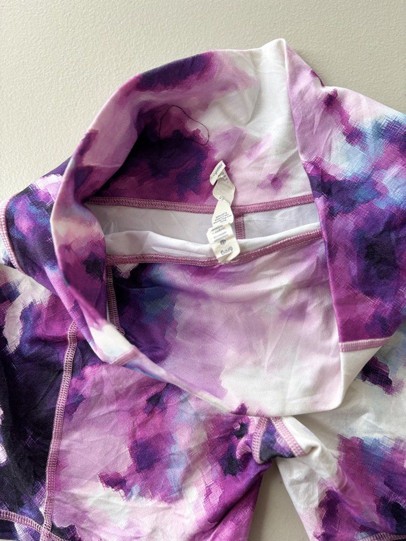 Lululemon Purple Tie Dye cycling (Category: Activewear) located in Iloilo. Submitted by oddforest.c9c7d5 (Listing ID 1467647382, Image 3). Description: - Brand: Lululemon - Style: High-waisted athletic shorts with signature logo on back waistband - Color/Print: Purple, blue, and white tie-dye watercolor - Fabric: Buttery soft, ideal for workouts or lounging -W 27-28 L 14.