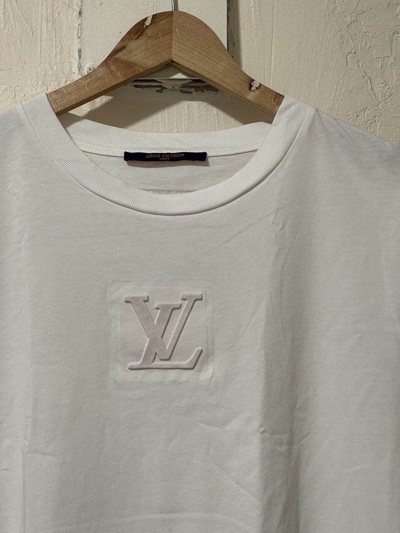 LV embosed tshirt size L (Category: Luxury Apparel) located in Marikina City. Submitted by joshuaades21107 (Listing ID 1469712176, Image 2). Description: Prada shirt Embosed design rubberized Large on tag Good condition.
