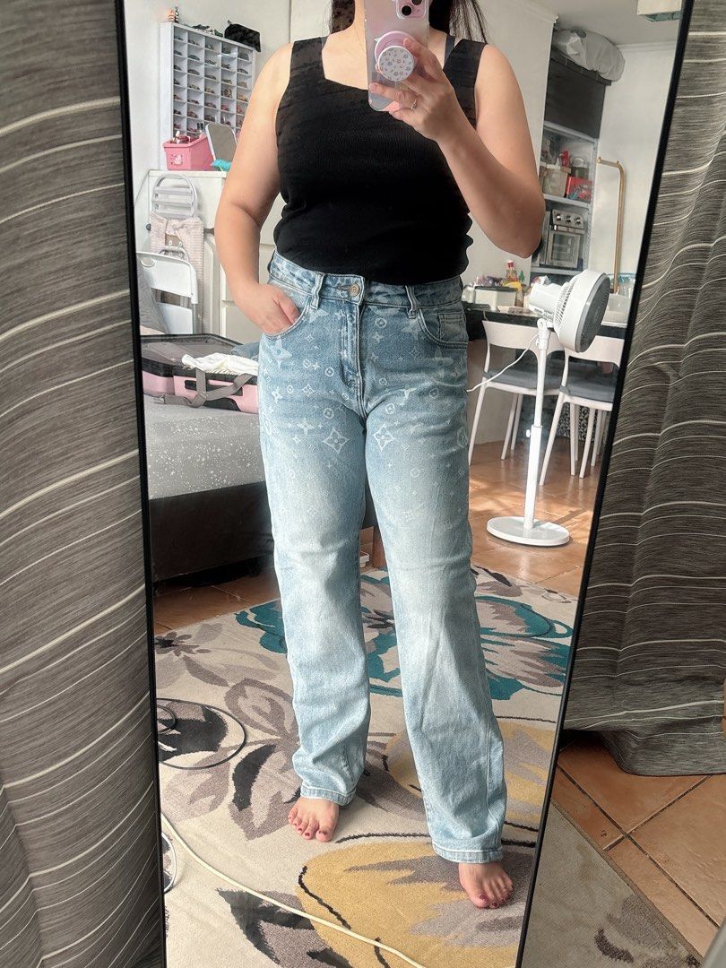 Lv mono pants size 32 (Category: Jeans) located in Manila. Submitted by cappadociadream (Listing ID 1469651934, Image 1). Description: - Style: Light wash blue denim pants with an all-over white monogram print - Fit: Straight leg, mid to high rise waist - Details: Front button closure, belt loops, front and back pockets - Material: Comfortable, high-quality cotton - Condition: Worn once for photos, super clean and ready to wear - Versatility: Eas