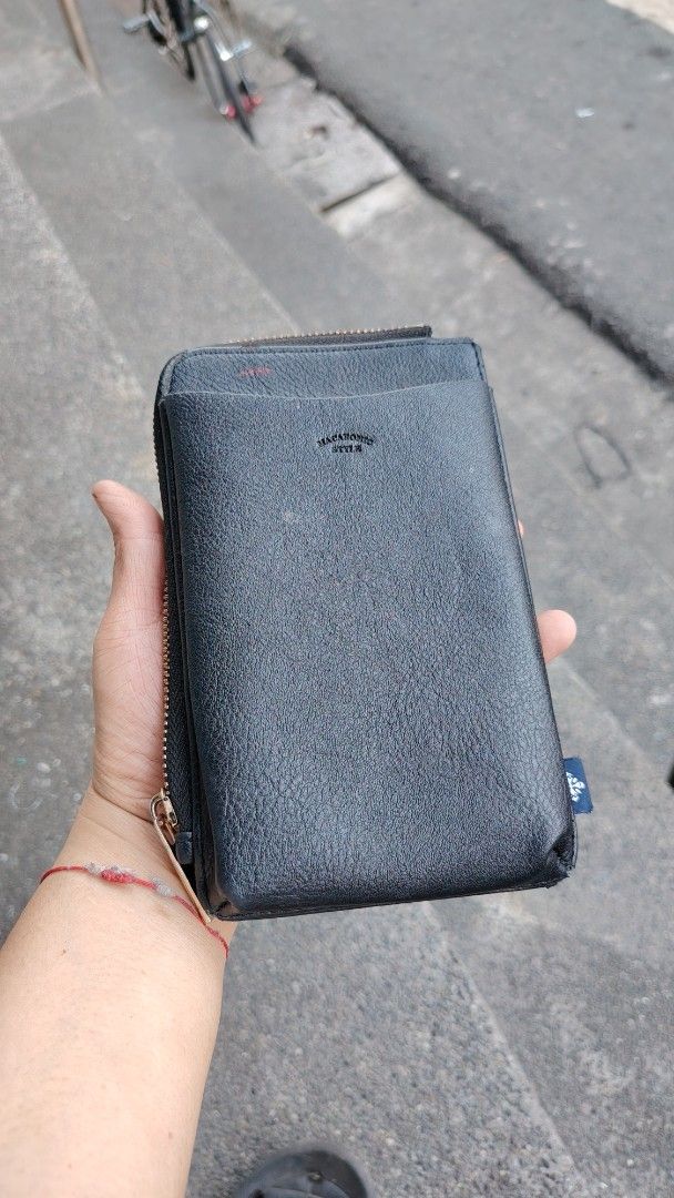 Macaronic Style Black Phone Wallet Organizer (Category: Wallets & Card holders) located in Manila. Submitted by purediamond888 (Listing ID 1469657864, Image 1). Description: - Brand: Macaronic Style - Material: Premium black faux leather with stylish - Closure: Secure zip-around design - Storage: Multiple card slots, cash compartments, and an inner zippered coin pocket - Exterior: Convenient slip pockets on both front and back - Versatility: Incl