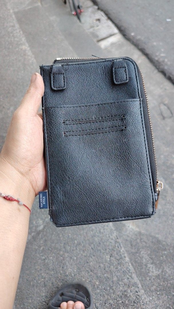 Macaronic Style Black Phone Wallet Organizer (Category: Wallets & Card holders) located in Manila. Submitted by purediamond888 (Listing ID 1469657864, Image 2). Description: - Brand: Macaronic Style - Material: Premium black faux leather with stylish - Closure: Secure zip-around design - Storage: Multiple card slots, cash compartments, and an inner zippered coin pocket - Exterior: Convenient slip pockets on both front and back - Versatility: Incl