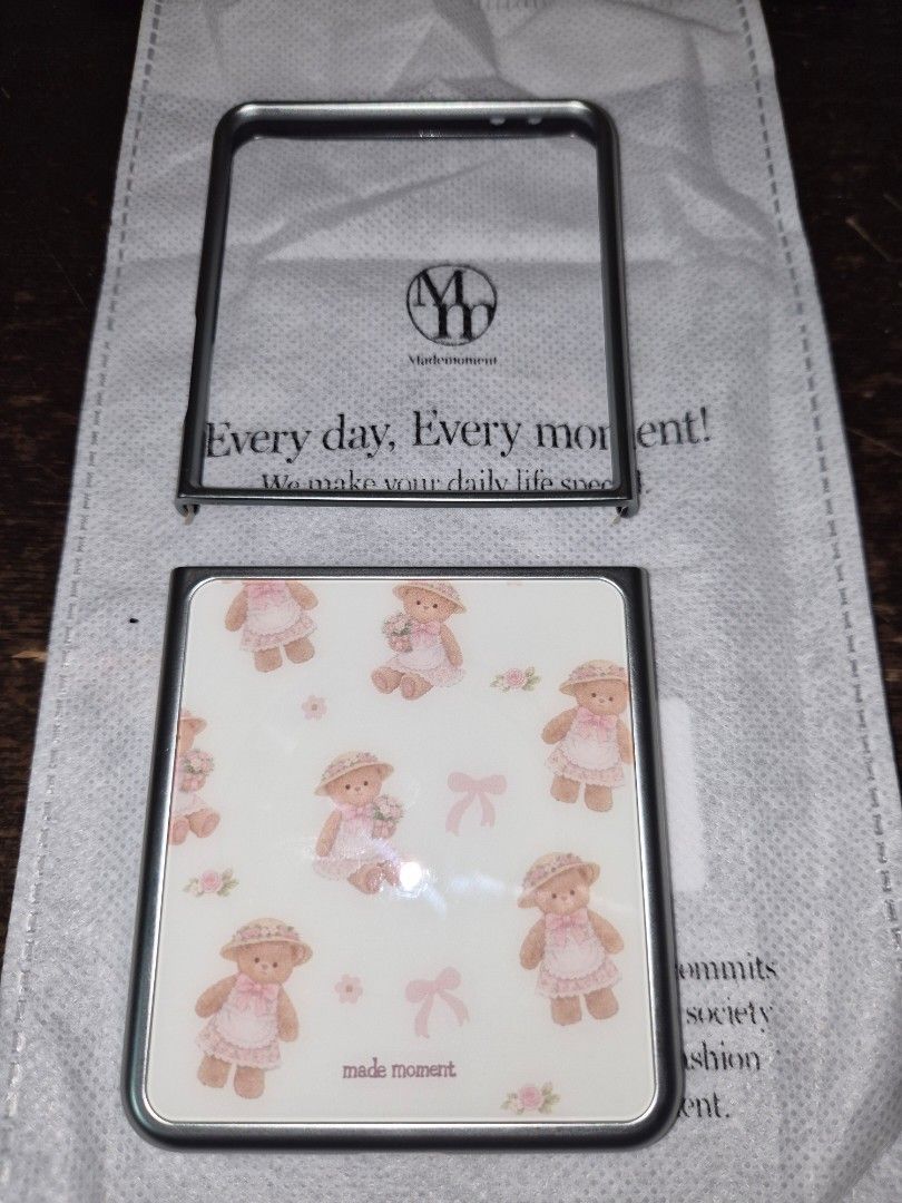 Made Moment Teddy Bear Z Flip Phone Case (Category: Cases & Sleeves) located in Mandaluyong City. Submitted by pechut.17 (Listing ID 1469674840, Image 1). Description: - Compatible with Samsung Z Flip 7 - Adorable teddy bear and pink bow pattern on a cream background - Stylish metallic silver frame edge - magsafe - Comes with packaging pouch - Brand new and ready to ship RFS: Delivery took too long. I really needed the case, so I purchased one th