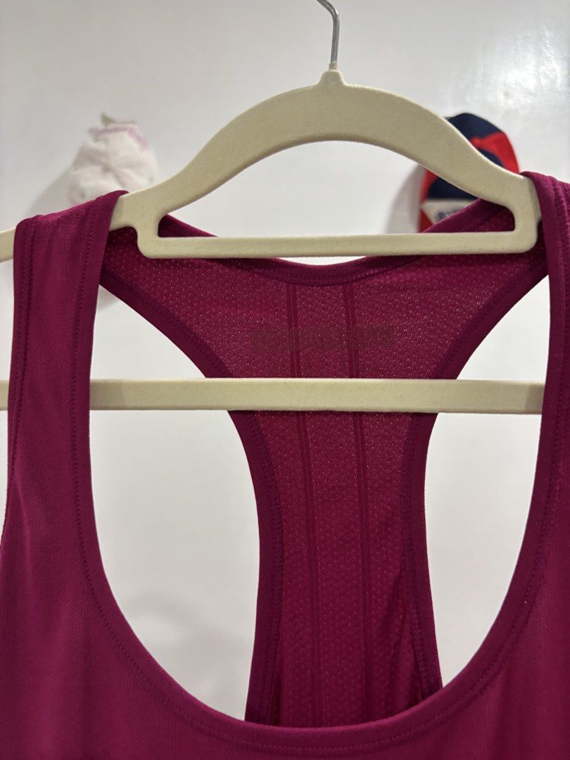 Magenta Racerback Workout Tank Top (Category: Activewear) located in Calbayog City. Submitted by zaxcheus_castillo1708 (Listing ID 1469673828, Image 2). Description: - Vibrant magenta activewear tank top, ideal for the gym, running, or workouts - Breathable mesh-like fabric keeps you cool and comfortable - Racerback style with a ribbed back panel for extra airflow - Features a small reflective logo on the lower left hem for visibility - Quick-dry