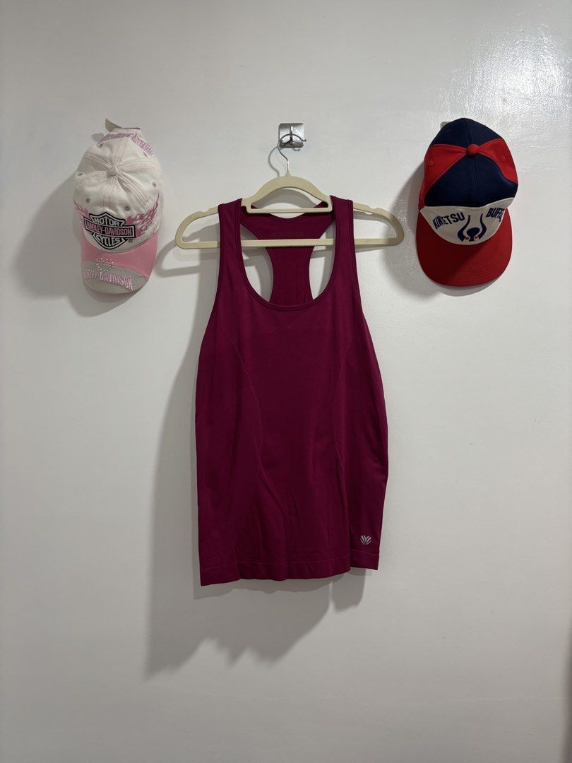Magenta Racerback Workout Tank Top (Category: Activewear) located in Calbayog City. Submitted by zaxcheus_castillo1708 (Listing ID 1469673828, Image 1). Description: - Vibrant magenta activewear tank top, ideal for the gym, running, or workouts - Breathable mesh-like fabric keeps you cool and comfortable - Racerback style with a ribbed back panel for extra airflow - Features a small reflective logo on the lower left hem for visibility - Quick-dry