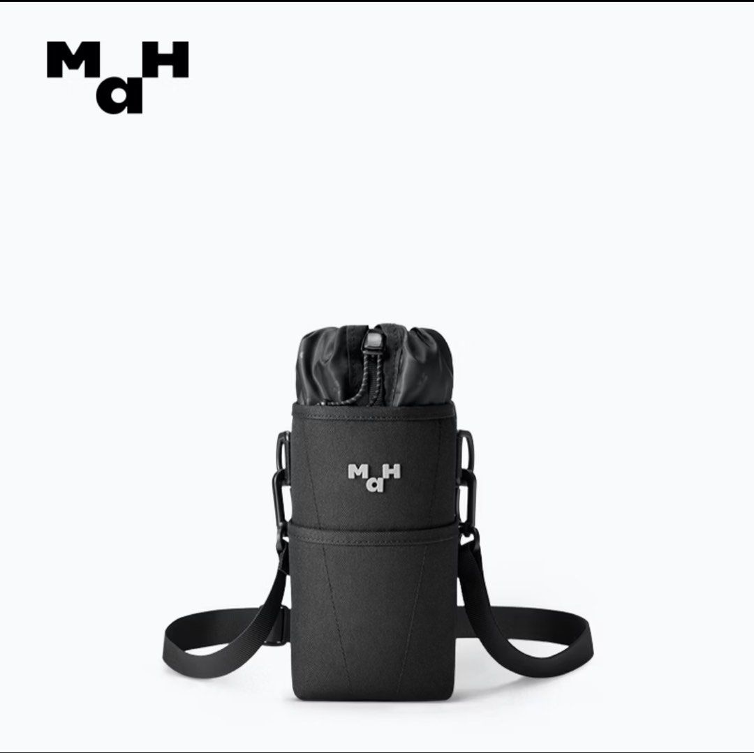 MaH Water Bottle Bag (Category: Cross-body Bags) located in Manila. Submitted by shaquilleoatmeal (Listing ID 1469582174, Image 1). Description: MaH water bottle bag in black. Features a secure drawstring top, adjustable shoulder strap, and minimalist logo design. Perfect for hands-free daily commutes, walks, or hikes. In clean condition..