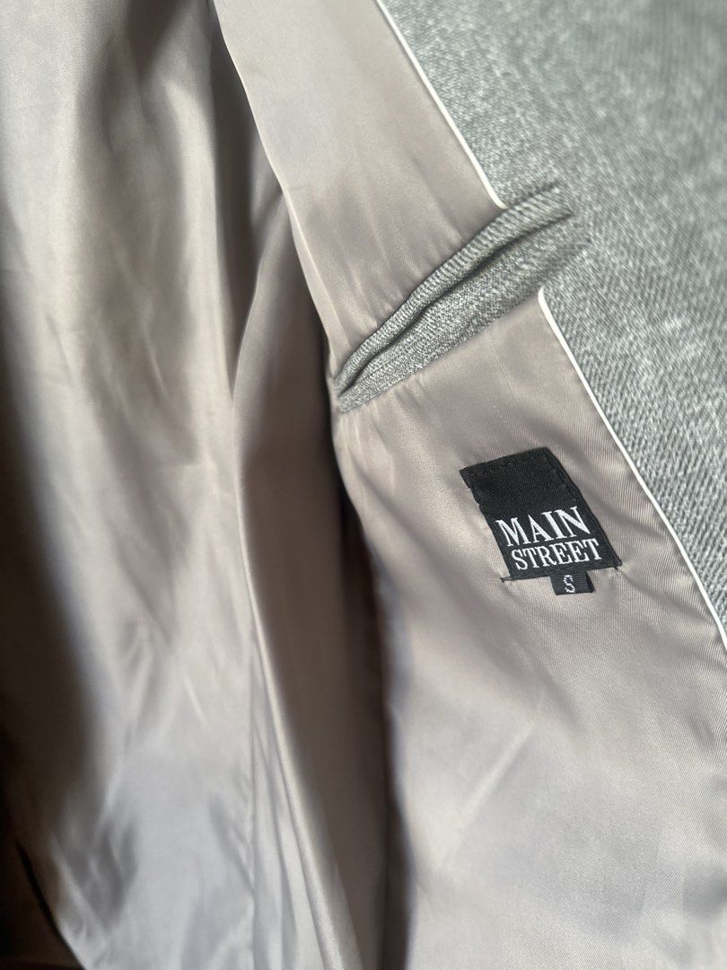 Main Street Grey Blazer Jacket Size S (Category: Coats, Jackets and Outerwear) located in Manila. Submitted by amazingamie8 (Listing ID 1469579873, Image 3). Description: - Brand: Main Street - Size: S - Color: Grey - Fully lined interior in smooth grey fabric - Single-button front closure - Classic lapel collar with structured shoulders - Two front pockets and one chest welt pocket - Single vent in the back - Clean finish and classic cut.