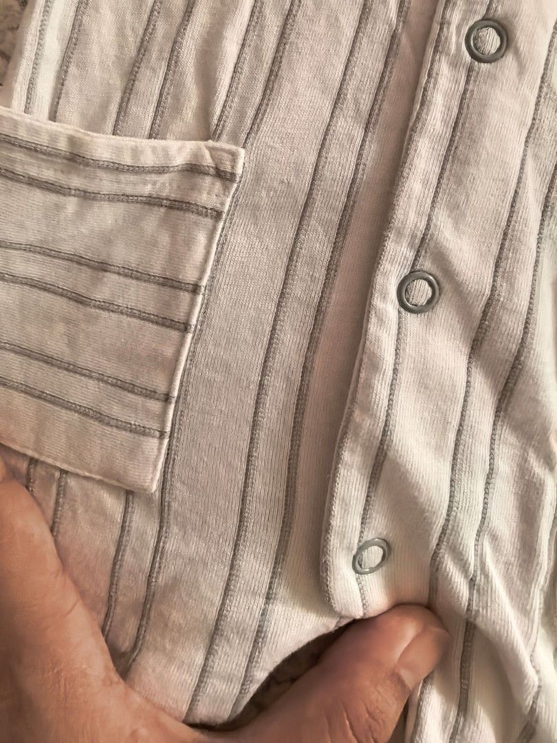 Mamas & Papas Striped Baby Romper (Category: Babies & Kids Fashion) located in Manila. Submitted by euladelosr38638 (Listing ID 1469651874, Image 3). Description: - Brand: Mamas & Papas - Size: Fits up to 1 month old - Design: White with grey vertical stripes - Material: Soft ribbed cotton - Features: Short sleeves, front snap button closure for easy changing, and two front pockets - Never been used, washed Can ship through orange app.