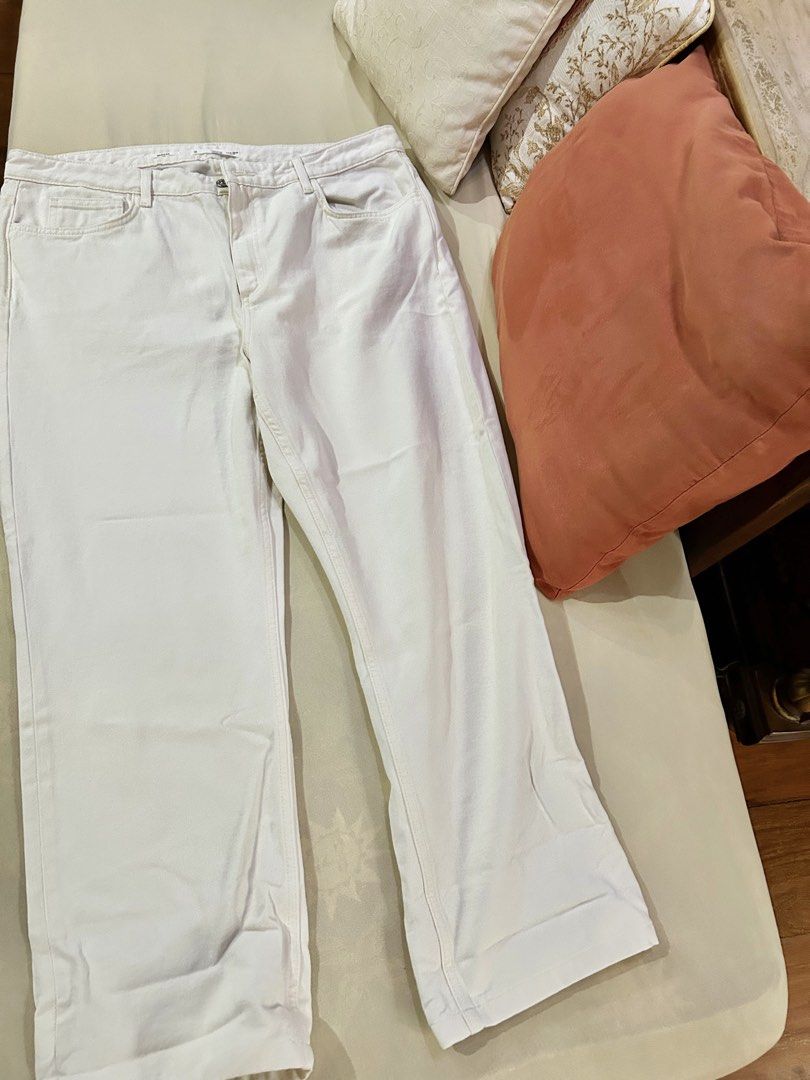 MANGO Denim White Jeans (Category: Jeans) located in Cainta. Submitted by unboxingstuff (Listing ID 1469659584, Image 3). Description: - Brand: MANGO - Brand new - Model: Beige/ Cream Denim Pants - Size: EUR 46 (loose fit and bigger than usual) - Fit: Classic straight / loose fit - Color: Clean white wash - Features: Front and back pockets, silver-toned button, zip fly closure - Condition: Excellent, easy to match with any top - Never used becaus