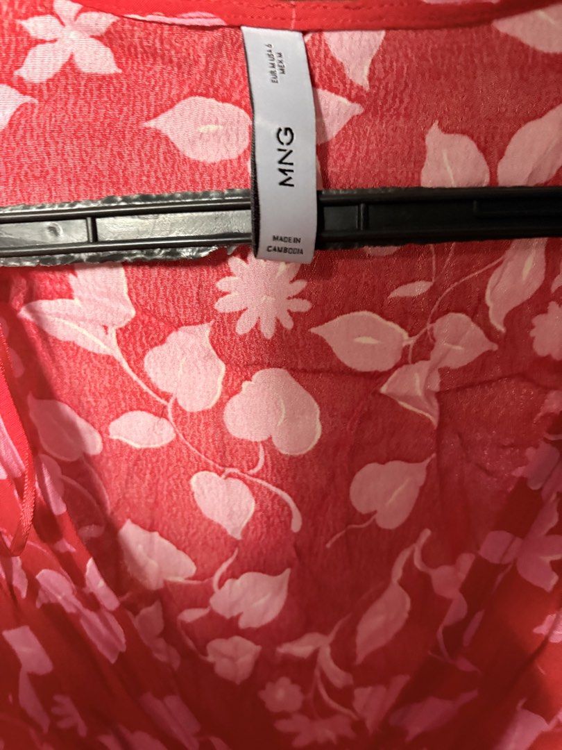 Mango Floral V-Neck Blouse Red Pink (Category: Blouses) located in Quezon City. Submitted by kitsukemen (Listing ID 1469599247, Image 3). Description: - Brand: Mango - Size: EUR M / US 6 - Color/Pattern: Bright red with pink floral & leaf print - Design: Long sleeves, V-neckline with front tie closure - Material: Lightweight & comfortable fabric - Origin: Made in Cambodia - Condition: Excellent pre-loved condition - Mode of Payment: GCash, BPI, o