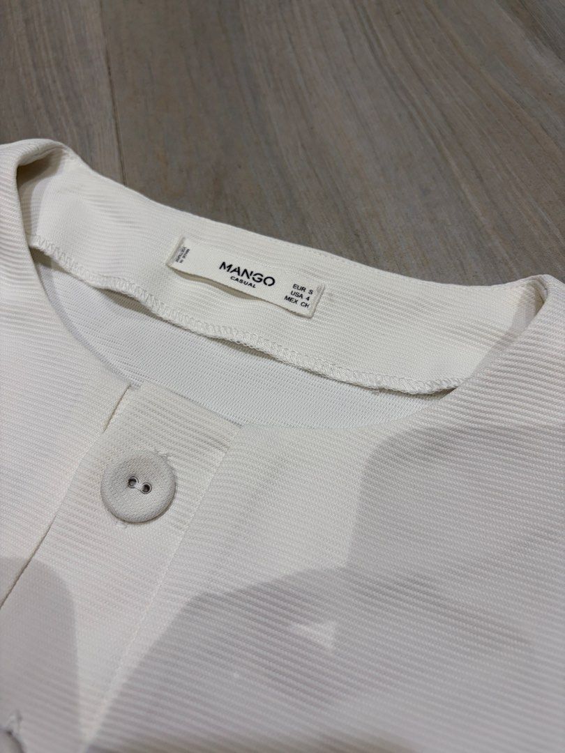 Mango White Shirt (Category: Shirts) located in Pasig City. Submitted by chamoisee (Listing ID 1469653000, Image 2). Description: Mango White Shirt 18.5”x20” visible stains due to storage can give as a freebie if purchased something .