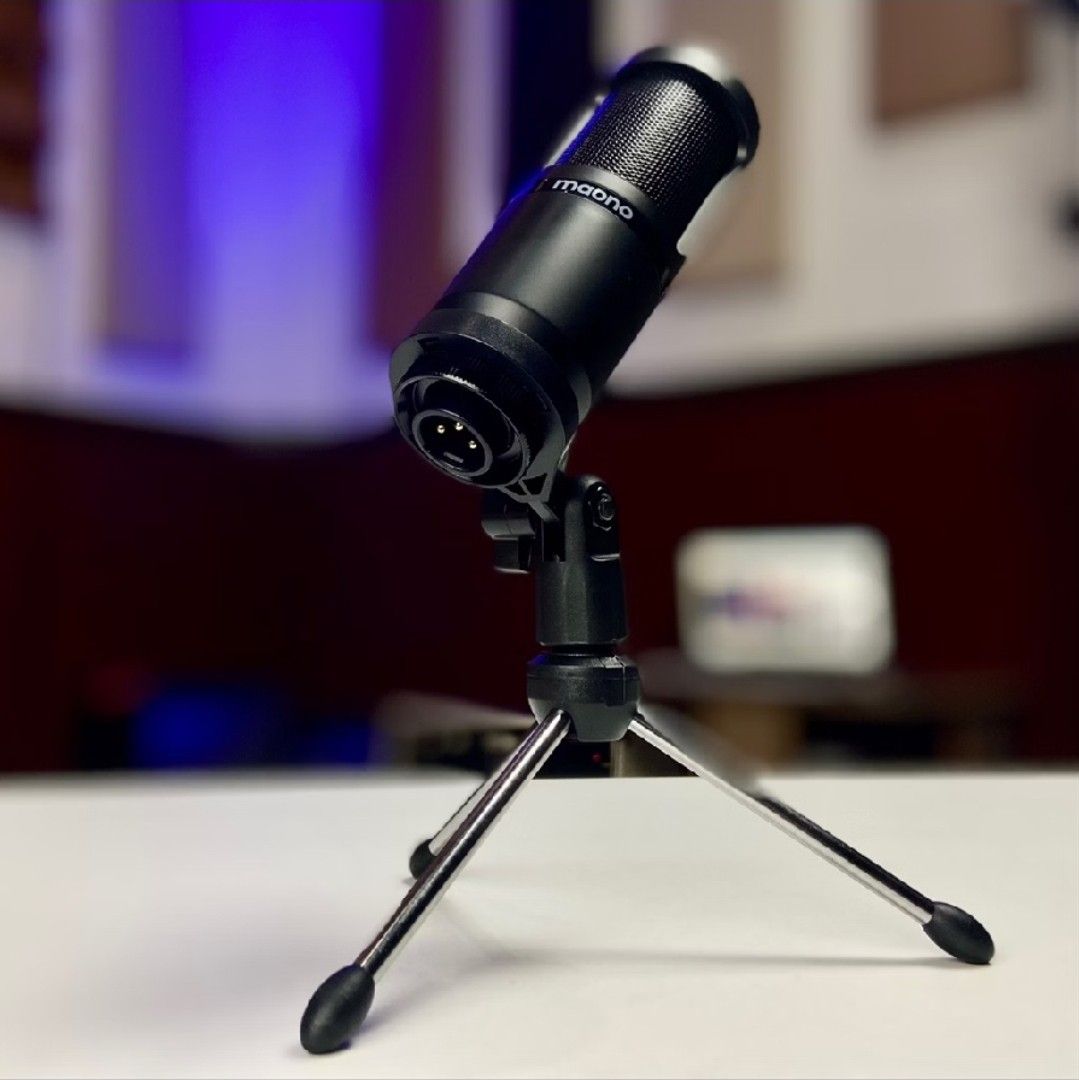 Maono Condenser Microphone with Tripod Stand (Category: Microphones) located in San Mateo. Submitted by reyshel08 (Listing ID 1469607414, Image 2). Description: - Model: Maono Condenser Microphone - Finish: Sleek matte black - Connectivity: Standard XLR connection at the base - Includes: Compact folding desk tripod stand - Audio Quality: Clean and crisp audio capture - Ideal Use: Great for podcasts, live streaming, and voice recordings - Conditio
