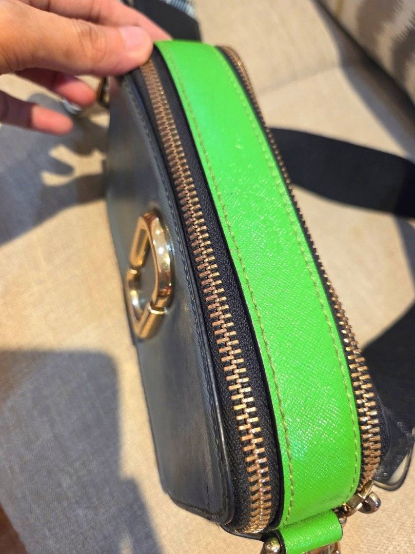 Marc Jacobs Snapshot Camera Bag with Plaid Strap (Category: Luxury Bags & Wallets) located in Manila. Submitted by mysticrabbit.284012 (Listing ID 1469581102, Image 3). Description: - Brand: Marc Jacobs - Style: Multi-color camera bag (Grey, Bright Green, Blue) - Hardware: Gold-tone hardware with leather zipper pull tabs - Compartments: Double zip closure with black fabric interior lining and slip pockets - Strap: Adjustable and thick webbed stra