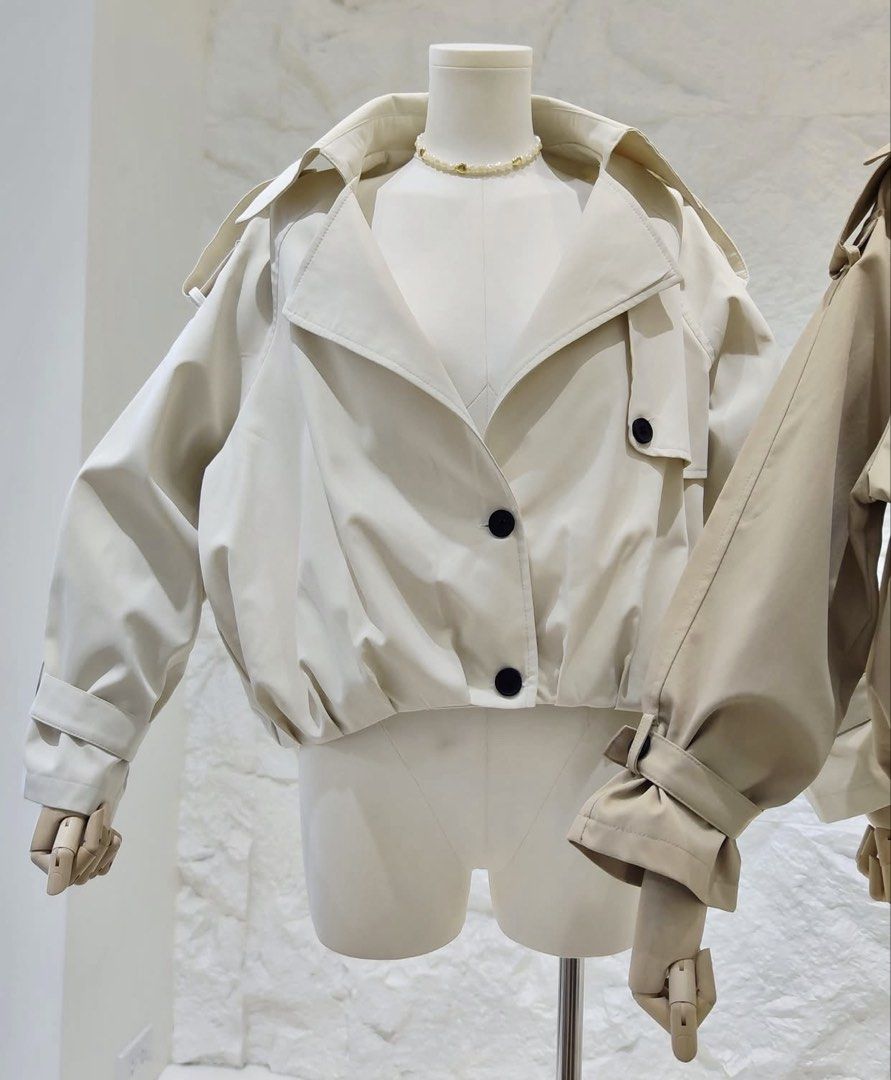 Maria Closet BKK Cropped Trench Jacket (Category: Coats, Jackets and Outerwear) located in Baguio. Submitted by anneslvd (Listing ID 1469640504, Image 3). Description: - Brand: Maria Closet BKK (Imported from Bangkok) - Style: Lightweight cropped trench jacket - Design details: Wide lapel collar, button front, and chic shoulder flaps - Cream color available only - Free-size (oversized fit) - Brand new with tags.