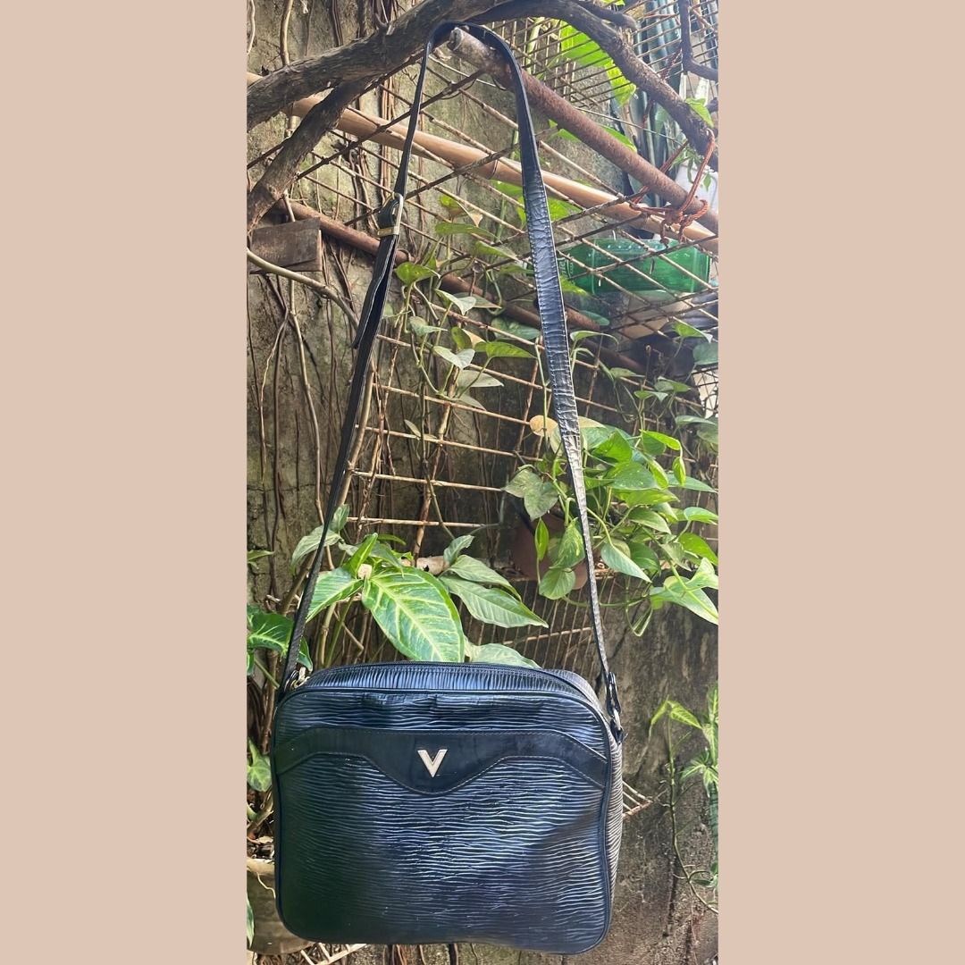Mario Valentino Black Textured Leather Shoulder Bag (Category: Luxury Bags & Wallets) located in Quezon City. Submitted by eilgaraje (Listing ID 1469711340, Image 2). Description: - Brand: Mario Valentino - Color: Classic Black - Material: Premium textured leather - Closure: Top zip with engraved logo metallic pull - Strap: Black leather/synthetic strap with secure metal ring attachments - Condition: Good pre-loved condition with minor wear aroun