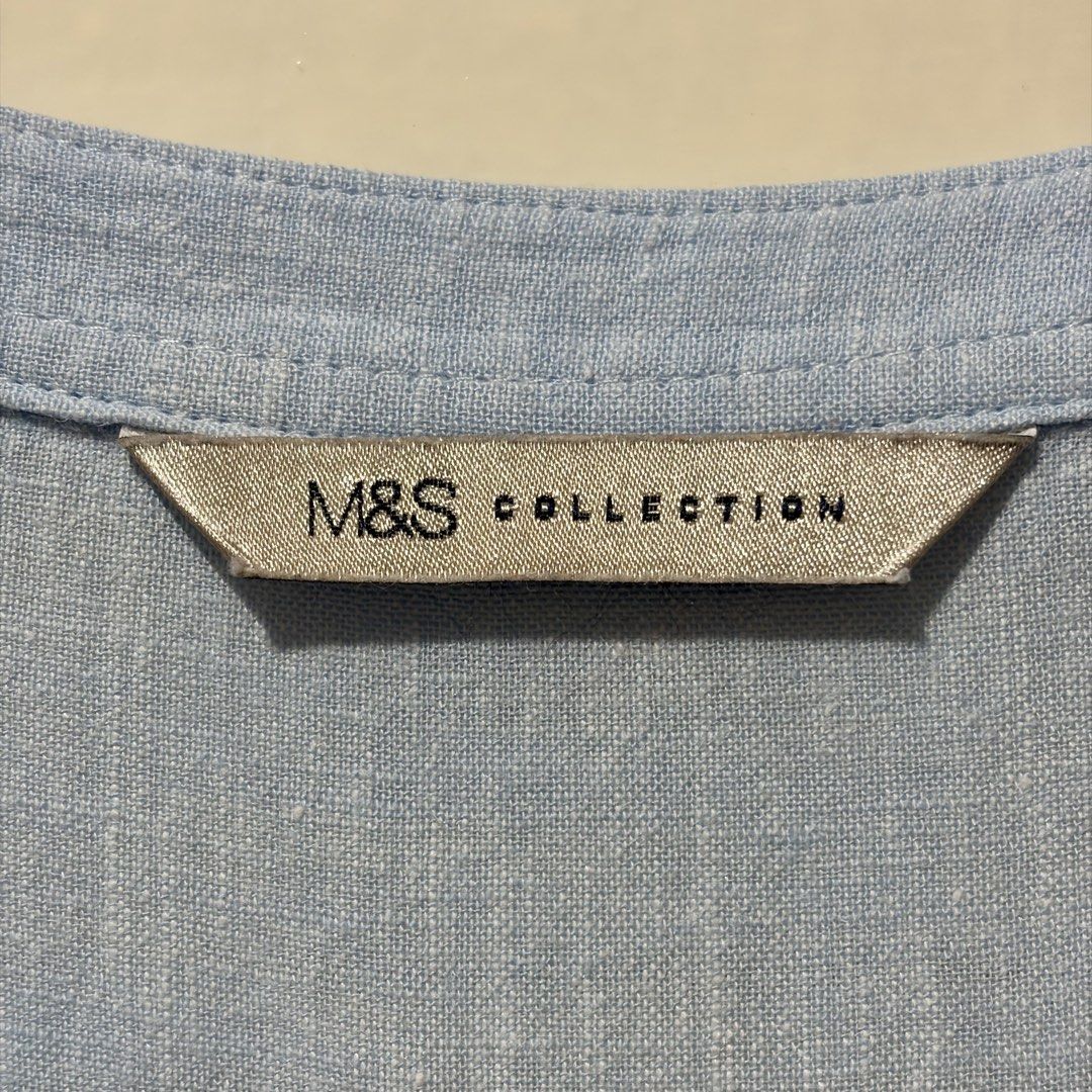 Marks & Spencer Linen Blend Chambray Top UK 16 (Category: Blouses) located in Quezon City. Submitted by tflquezoncity (Listing ID 1469737766, Image 3). Description: ❤️ Marks & Spencer ❤️ UK 16 ❤️ Linen-viscose blend ❤️ Light blue chambray ❤️ Button-down neckline, chest pocket, delicate eyelet trim ❤️ Great condition, no issues ❤️ Easy to pair with leggings or shorts for casual everyday wear.