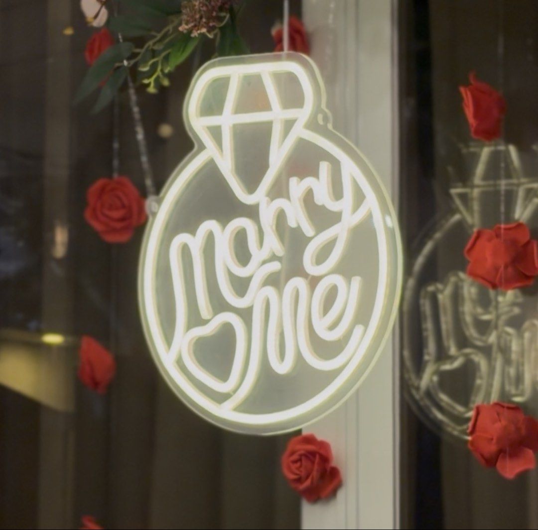Marry Me Ring LED Neon Sign Light Proposal Decor (Category: Other Home Appliances) located in Las Pinas. Submitted by sportyyyyy (Listing ID 1469689817, Image 1). Description: - Design: "Marry Me" text with a cute heart at the bottom and a diamond on top - Backing: Clear acrylic for a clean, floating look - Power: USB powered with a convenient inline switch on the white cord - Versatile: Ideal for marriage proposals, engagement parties, and roman