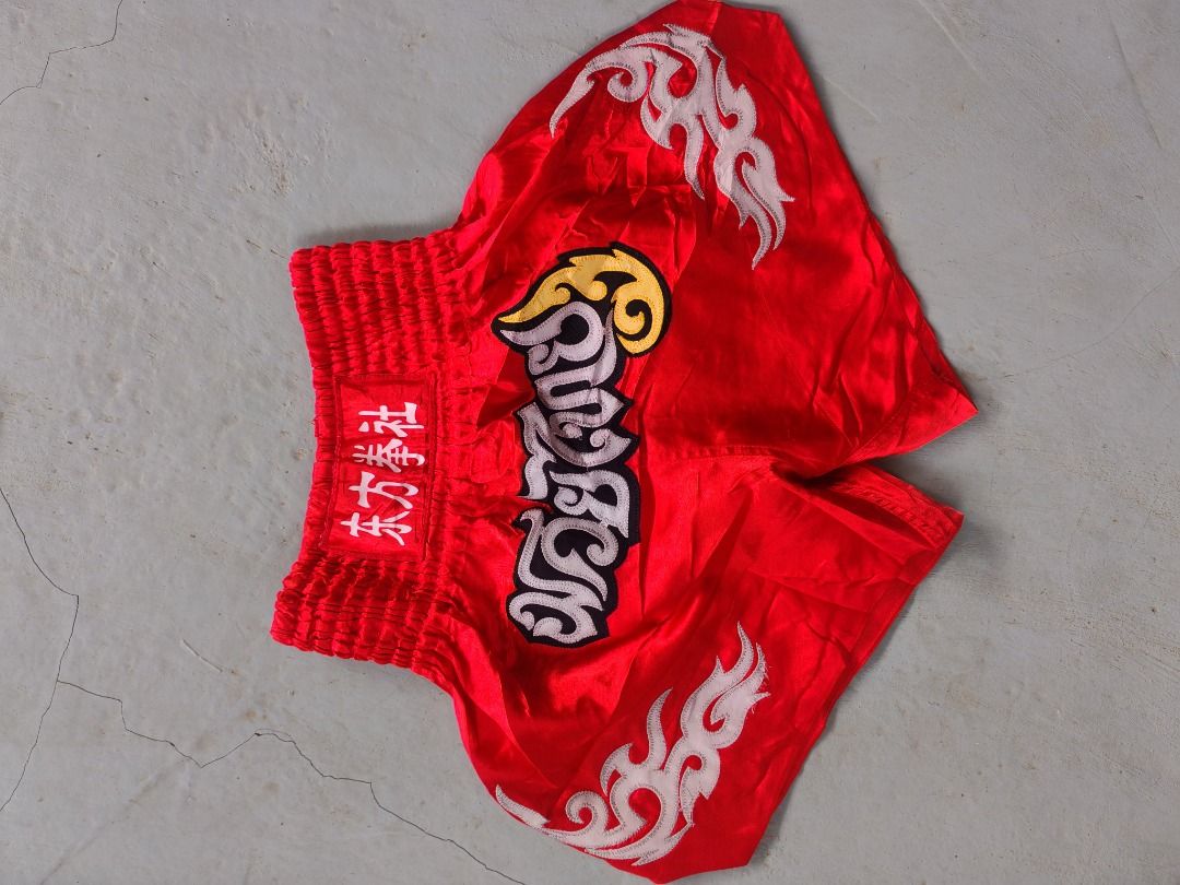 Martial arts fighting shorts bundle red and black (Category: Shorts) located in Caloocan City. Submitted by silverbird_6c038f (Listing ID 1469601091, Image 2). Description: - Set of 2 martial arts shorts for training and sparring - Pair 1: Red with white flame graphics and Chinese lettering embroidery - Pair 2: Black and gold with Chinese characters and a Chinese flag patch - Comfortable elastic waistband on both pairs - Great for gym workouts, m