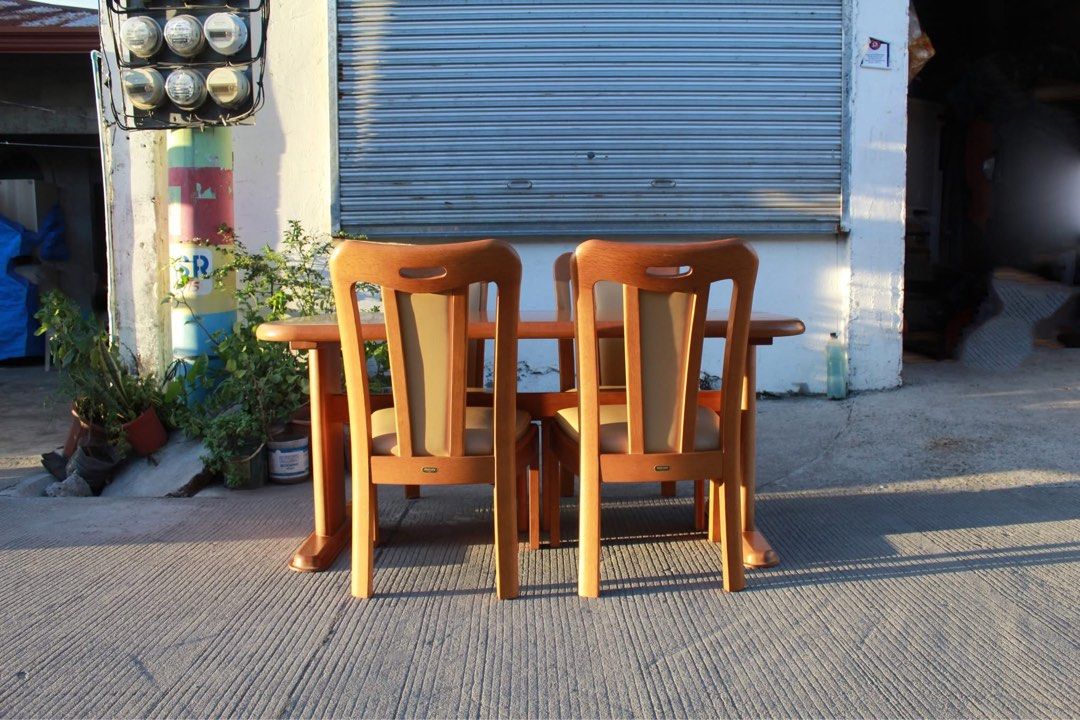 MARUNI 4-Seater Solid Wood Dining Set 🇯🇵🇯🇵🇯🇵 (Category: Tables & Sets) located in San Fernando. Submitted by juls.japan.surplus (Listing ID 1469715515, Image 3). Description: MARUNI 4-Seater Solid Wood Dining Set Heavy solid wood dining set in a warm honey-oak finish, with a sturdy dual-pedestal table and four matching high-back wooden chairs with curved backrests and padded leather seats. Classic Japanese craftsmanship, perfect for elegant