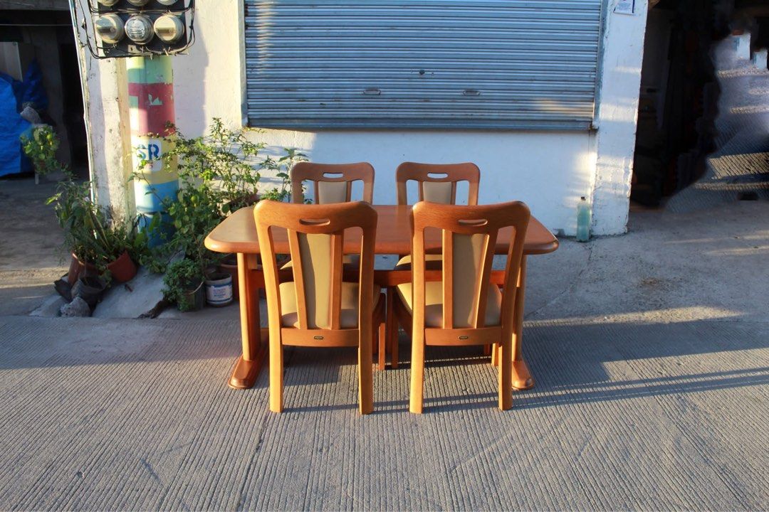MARUNI 4-Seater Solid Wood Dining Set 🇯🇵🇯🇵🇯🇵 (Category: Tables & Sets) located in San Fernando. Submitted by juls.japan.surplus (Listing ID 1469715515, Image 2). Description: MARUNI 4-Seater Solid Wood Dining Set Heavy solid wood dining set in a warm honey-oak finish, with a sturdy dual-pedestal table and four matching high-back wooden chairs with curved backrests and padded leather seats. Classic Japanese craftsmanship, perfect for elegant