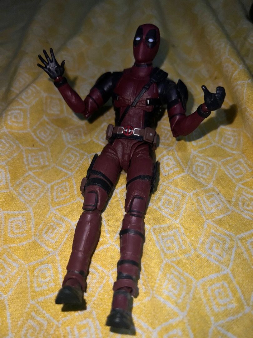 Marvel Legends Deadpool Action Figure (Category: Figurines & Statues) located in Caloocan City. Submitted by mherckyyragkee (Listing ID 1469676000, Image 2). Description: - Character: Deadpool - Condition: Loose figure (no box or extra accessories included) - Design: Detailed red and black tactical suit with straps and belt - Articulation: Fully articulated with multiple joints at shoulders, elbows, hips, and knees - Hands: Right hand open, left 