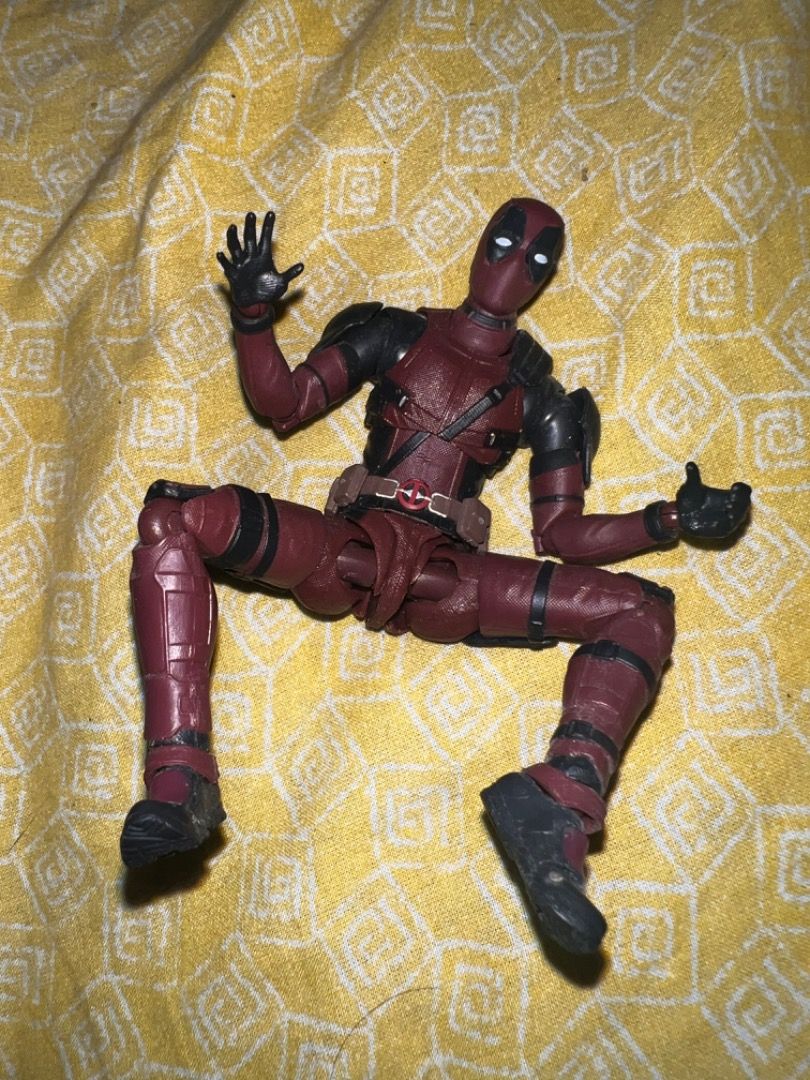 Marvel Legends Deadpool Action Figure (Category: Figurines & Statues) located in Caloocan City. Submitted by mherckyyragkee (Listing ID 1469676000, Image 1). Description: - Character: Deadpool - Condition: Loose figure (no box or extra accessories included) - Design: Detailed red and black tactical suit with straps and belt - Articulation: Fully articulated with multiple joints at shoulders, elbows, hips, and knees - Hands: Right hand open, left 