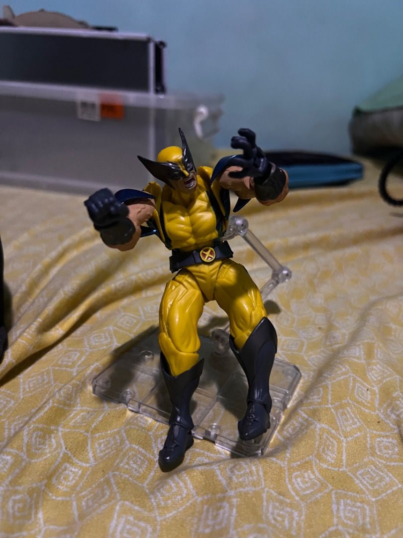 Marvel Wolverine Action Figure with Stand (Category: Figurines & Statues) located in Caloocan City. Submitted by mherckyyragkee (Listing ID 1469675411, Image 1). Description: - Iconic Wolverine action figure in his classic yellow and blue suit - Features a detailed sculpt on the mask, arms, and boots - Fully articulated with smooth-moving joints for easy posing - Includes a clear plastic display stand for a dynamic mid-action look - Perfect colle