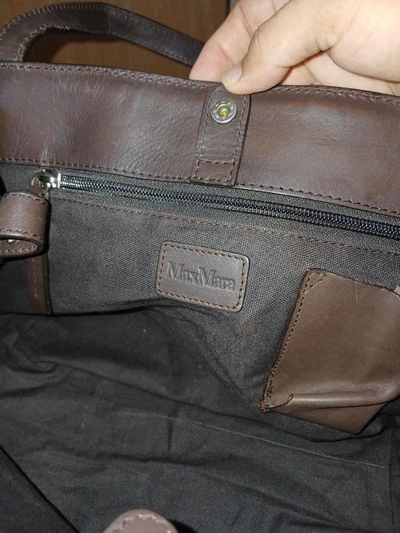 Max Mara woven leather shoulder bag brown (Category: Luxury Bags & Wallets) located in Daraga. Submitted by thethriftcity2024 (Listing ID 1469607339, Image 2). Description: - Brand: Max Mara - Material: Genuine woven leather in dark brown (intrecciato pattern) - Closure: Magnetic snap top - Interior: Dark fabric lining with zipper pocket and branded leather patch - Straps: Dual shoulder straps - Condition: Minor scuffing on the woven edges at the