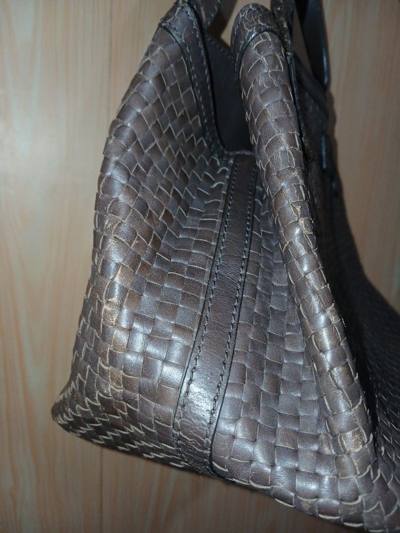 Max Mara woven leather shoulder bag brown (Category: Luxury Bags & Wallets) located in Daraga. Submitted by thethriftcity2024 (Listing ID 1469607339, Image 3). Description: - Brand: Max Mara - Material: Genuine woven leather in dark brown (intrecciato pattern) - Closure: Magnetic snap top - Interior: Dark fabric lining with zipper pocket and branded leather patch - Straps: Dual shoulder straps - Condition: Minor scuffing on the woven edges at the