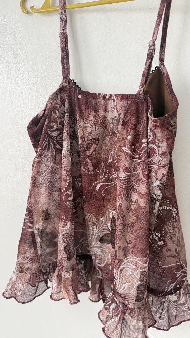 Mesh Cami Top (Category: Sleeveless) located in Cainta. Submitted by getsometin (Listing ID 1469682024, Image 3). Description: - Color/Pattern: Brown with all-over butterfly and floral print - Material: Very lightweight and flowy sheer mesh fabric - Features: Adjustable spaghetti straps and ruched front with self-tie string - Hem: Trendy lettuce hem finish - Styling: Great layering piece for various outfits.