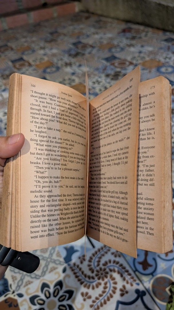 Message in a Bottle by Nicholas Sparks (Category: Storybooks) located in Manila. Submitted by alypacis06 (Listing ID 1469659706, Image 3). Description: - Title: Message in a Bottle by Nicholas Sparks - Format: Paperback edition - Condition: Well-loved with yellowed pages and creased cover, but fully readable - Genre: Contemporary romance / emotional fiction - Perfect as a casual, heart-wrenching beach read.