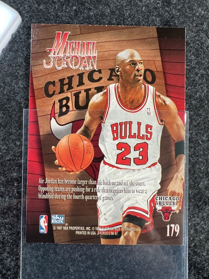 Michael Jordan (Category: Raw Singles) located in Mandaluyong City. Submitted by maropa (Listing ID 1469589278, Image 2). Description: - Player: Michael Jordan - Set: 1996-97 SkyBox Z-Force - Card Number: 179 - Condition: Stored in a protective plastic sleeve - Features: Gold background action shot on front, stats and bio on back - Ideal for: Chicago Bulls fans and sports card collectors.