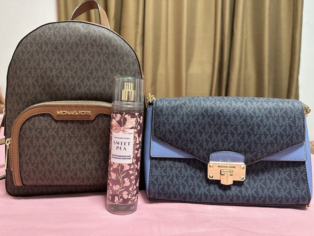 Michael Kors Backpack, Crossbody Bag & Bath & Body Works Mist Bundle (Category: Luxury Bags & Wallets) located in Minalin. Submitted by liatriestosell (Listing ID 1469647467, Image 1). Description: 2+1 bundle SALE (2 MK bag + free BBW mist) - Items for sale: Two Michael Kors bags and one Bath & Body Works mist - Item 1: Brown monogram backpack with brown leather trim, gold-tone zippers, and front pocket - Item 2: Blue and dark grey monogram cross