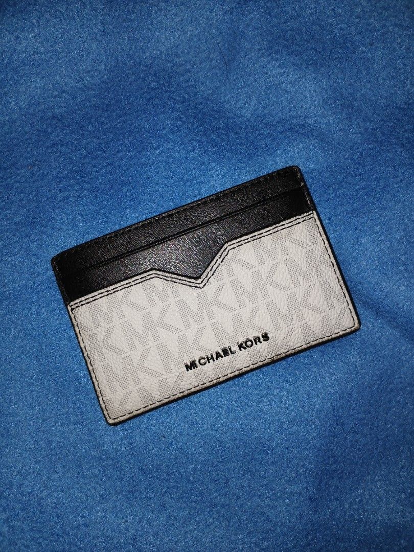 Michael Kors card holder (Category: Wallets & Card Holders) located in Quezon City. Submitted by dealmaker8 (Listing ID 1469610252, Image 1). Description: Michael Kors Hudson Signature Logo Notched Card Case slightly used Good as new.