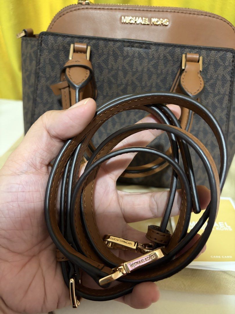 Michael Kors Daria Satchel (small) (Category: Luxury Bags & Wallets) located in Borongan. Submitted by charmspreloveddd (Listing ID 1469637776, Image 2). Description: - 100% Authentic Michael Kors Daria Small 2-in-1 Satchel - Color: Brown monogram print with tan leather details and gold-tone hardware - Versatile carry: Double top handles + adjustable, detachable shoulder strap - Interior: Secure top zip closure, logo fabric lining, and handy slip