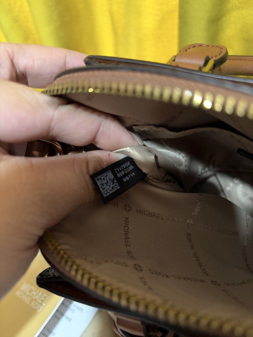 Michael Kors Daria Satchel (small) (Category: Luxury Bags & Wallets) located in Borongan. Submitted by charmspreloveddd (Listing ID 1469637776, Image 3). Description: - 100% Authentic Michael Kors Daria Small 2-in-1 Satchel - Color: Brown monogram print with tan leather details and gold-tone hardware - Versatile carry: Double top handles + adjustable, detachable shoulder strap - Interior: Secure top zip closure, logo fabric lining, and handy slip