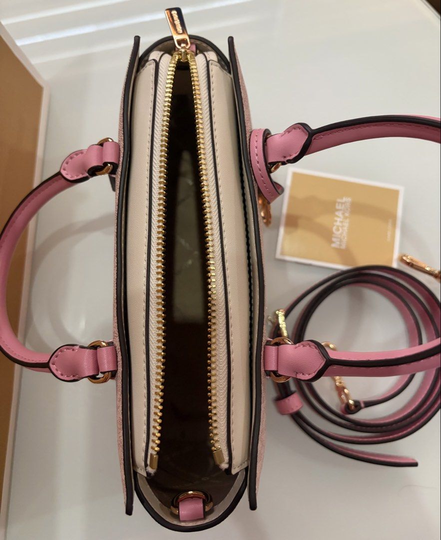Michael Kors Pink MK Monogram Satchel Bag (Category: Luxury Bags & Wallets) located in Makati City. Submitted by shukufukucy (Listing ID 1469720493, Image 3). Description: Michael Kors Mini Bag * MK Pink Mini Bag with Strap * 8.75”W X 5.25”H X 3”D * Brand New from MK Japan * with Dust Bag ＆Paper Bag * Selling Price: Php 21,000.00 Note: Mode of Payment: * Gcash * Maya * Bank Transfer **Payment first before Pick Up by Lalamove or Grab arranged by c
