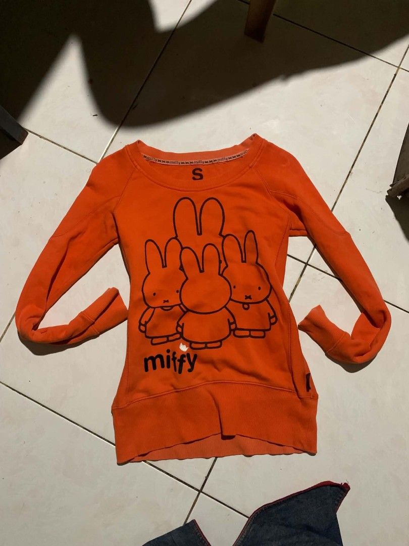 Miffy Orange Long Sleeve Sweater Size S (Category: Longsleeves) located in Manila. Submitted by atashaaaaa (Listing ID 1469690913, Image 1). Description: - Bright orange long sleeve sweater with cute Miffy graphic prints - Size: S (features branded neck tape) - Material: Soft and comfortable cotton knit - Features: Miffy logo near bottom hem, with ribbed cuffs and hemline - Fit: Relaxed and cozy for everyday wear - Condition: Brand new / Excellen