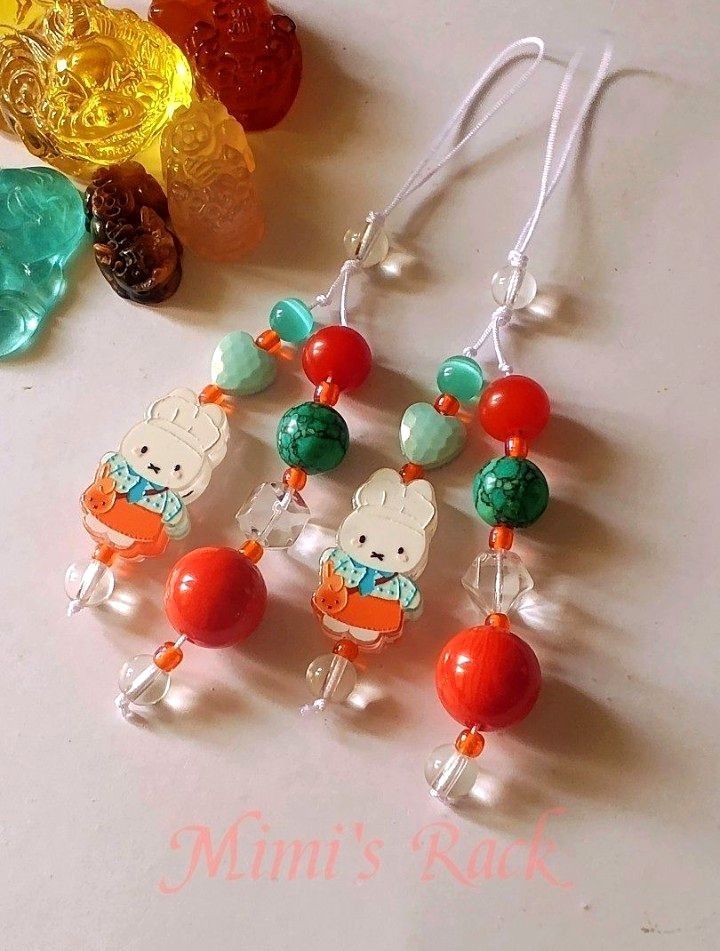 Miffy Summer Pop Charm (Category: Charms) located in Taguig. Submitted by mimisrack (Listing ID 1469743497, Image 3). Description: 🧡A cheerful and playful Miffy inspired charm featuring vibrant nanhong agate, turquoise, and teal cat's eye accents. -The bright citrus colors and adorable Miffy charm make this piece a fun statement accessory for everyday use. -Perfect for phones, bags, pouches, wallets, and keys 🧿 stones: teal cat's eye, turquoise