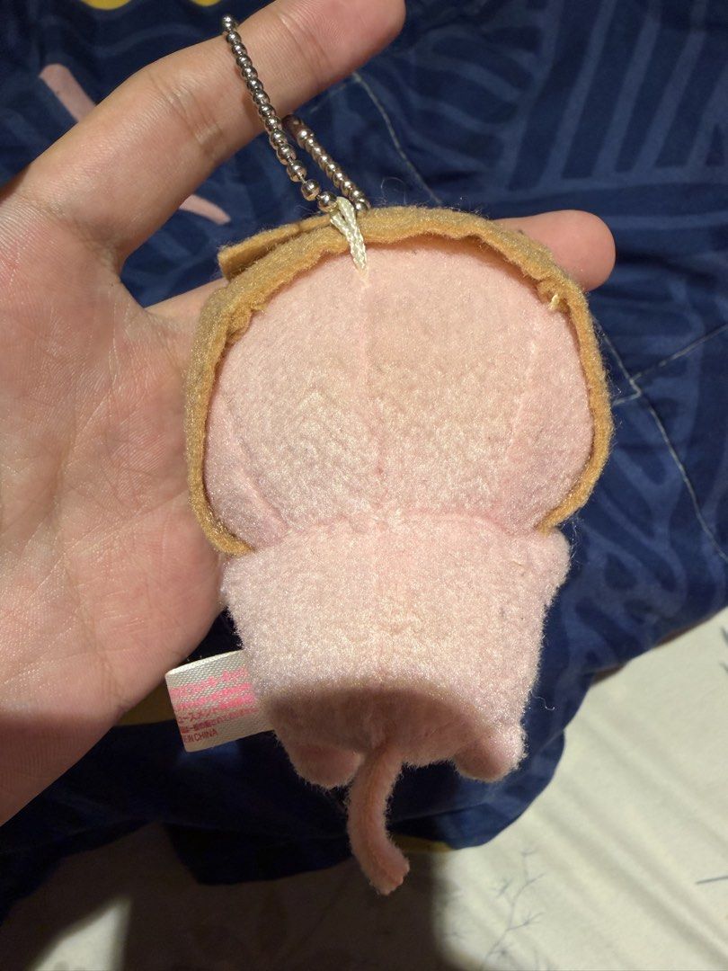Mikan Neko Cat Plush Keychain In Bread (Category: Plushies & Soft Toys) located in Makati City. Submitted by squishycorner (Listing ID 1469713935, Image 2). Description: - Authentic Mikan Neko cat plush keychain - Adorable design wearing a slice of toast with embroidered face and whiskers - Clean, fluffy, and well-maintained condition - Original side tag still attached - Comes with a silver ball chain, ready to hang on your bag or keys.